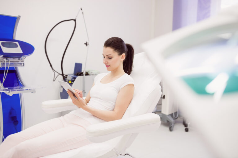 Beautiful women using digital tablet in clinic